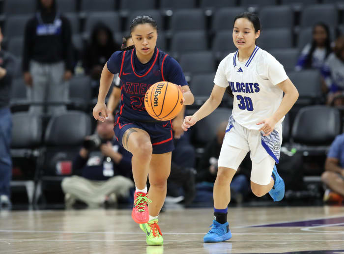 Montgomery's Susanna Paliza dribbles down court against the defense of Remember Chit (30).